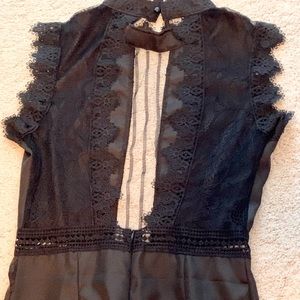 Black jump-suit with lace work on top. Never worn!